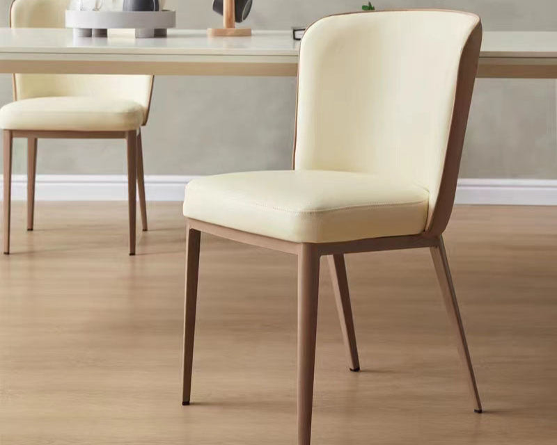 A stylish chair featuring a rich cinnamon hue on both the seat and the curved backrest, supported by dark metallic frames