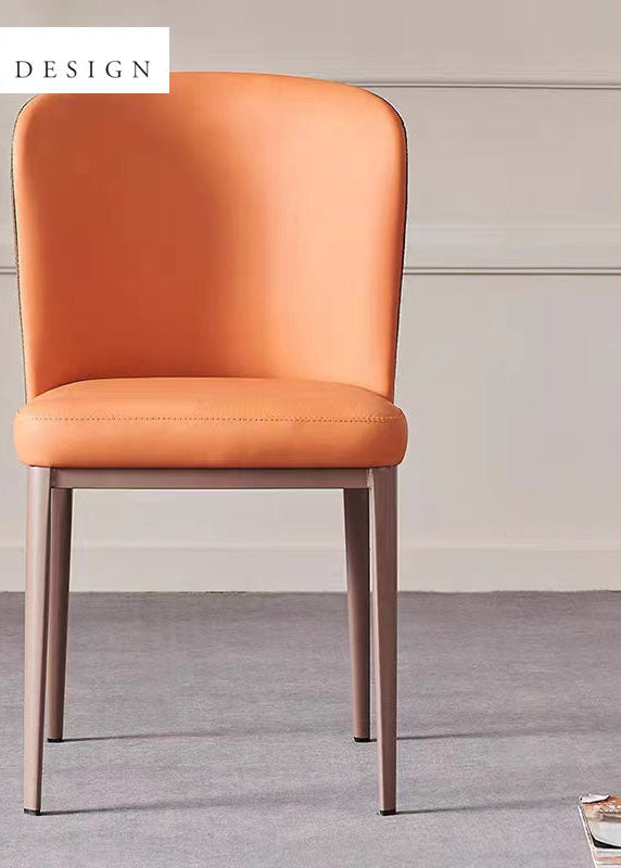 A stylish chair featuring a rich cinnamon hue on both the seat and the curved backrest, supported by dark metallic frames