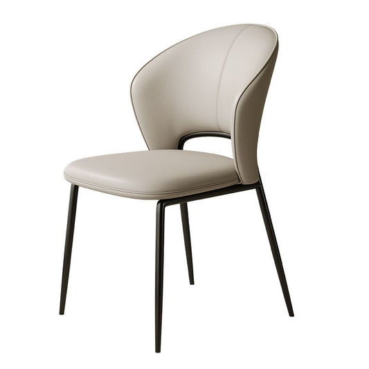 A sleek chair featuring a beige curved backrest and seat, complemented by slender black metal legs