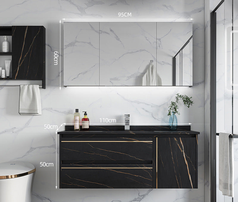 Modern black bathroom furniture with gold accents and smart lighting