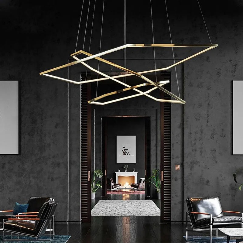 Gold geometric multi-ring LED chandelier suspended from ceiling