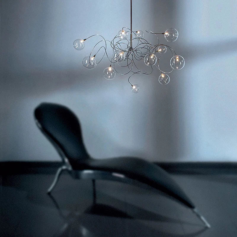 Smoke glass branching chandelier over dining table