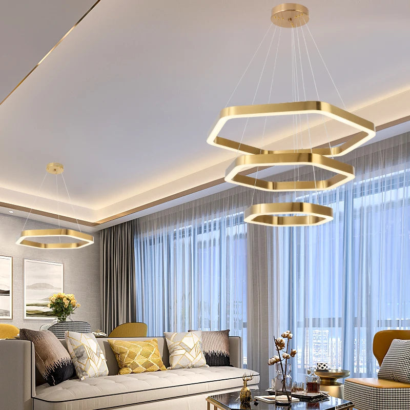 Hexagon gold LED pendant light suspended from ceiling