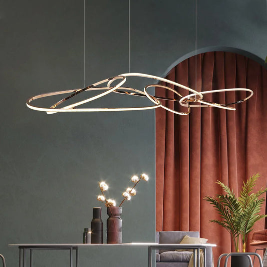 Long curved LED ceiling light with adjustable suspension