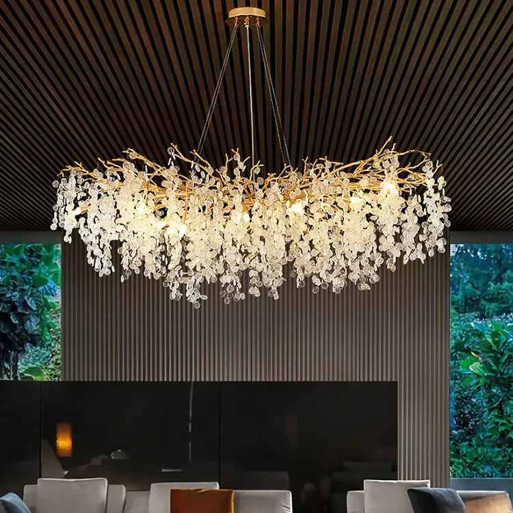 Modern gold chandelier over living room seating