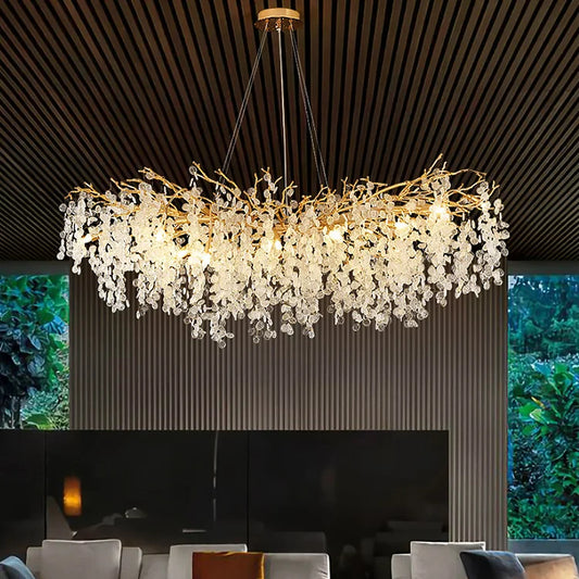 Modern gold chandelier over living room seating