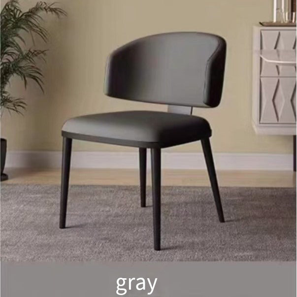 A modern chair featuring a smooth charcoal upholstery with a contoured backrest and robust black legs