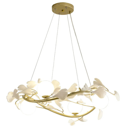 Designer pendant light inspired by ginkgo leaves above dining table