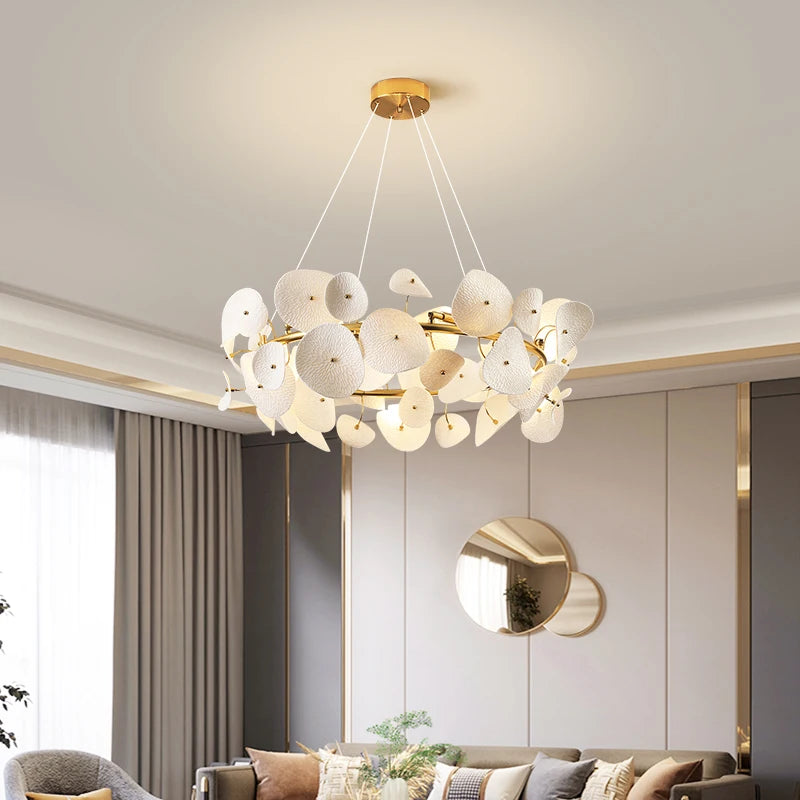 Gold branch chandelier over modern dining table