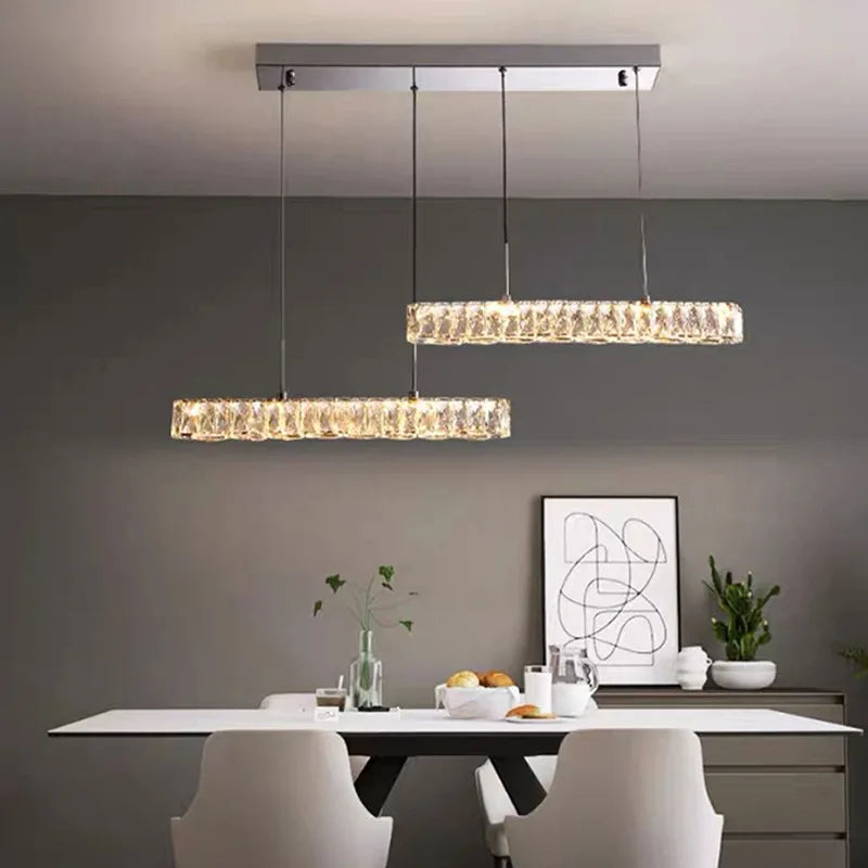 Linear minimalist LED chandelier over dining table
