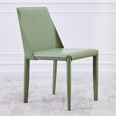 A modern chair enveloped in a smooth copper tone with a streamlined design and precise stitching along the edges
