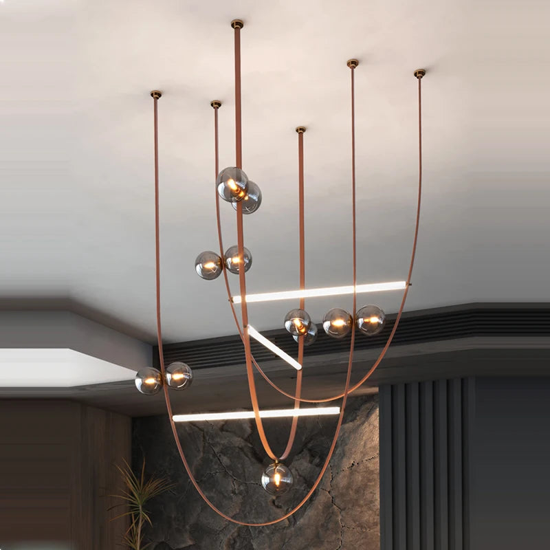Smoked glass globe ceiling light with looping straps