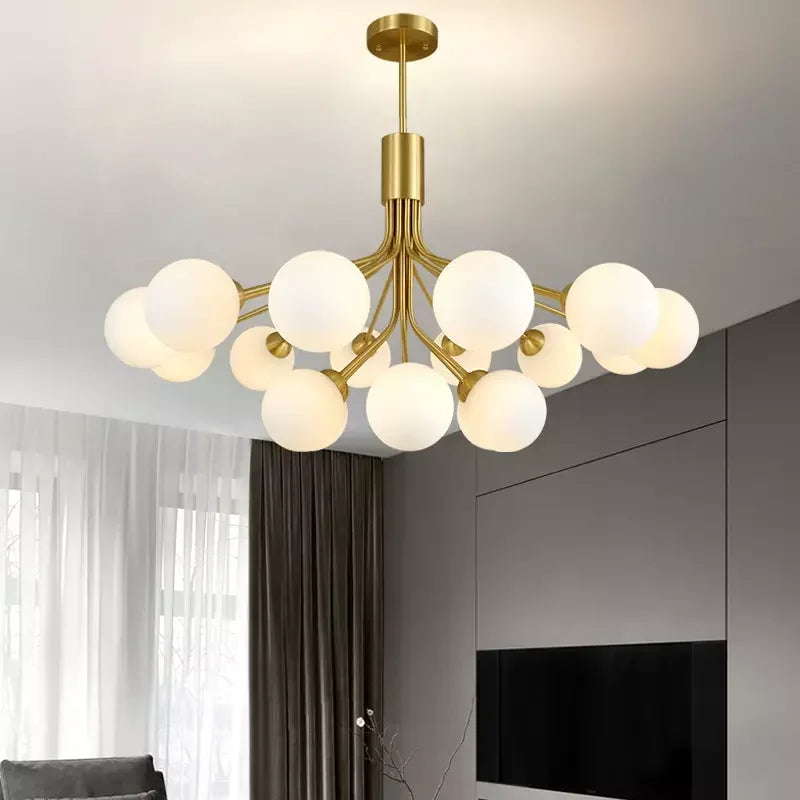 Gold frosted glass ball chandelier over dining table
