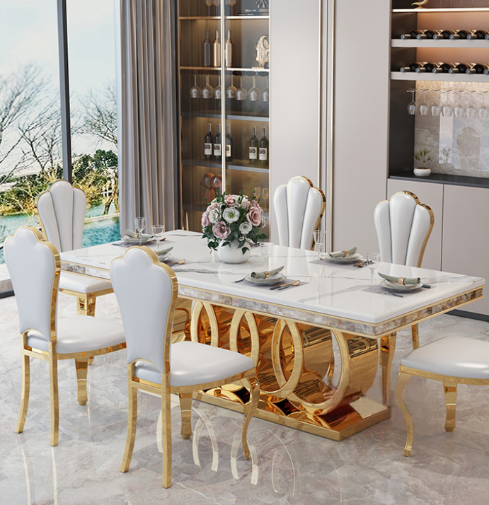 light luxury dining table set featuring a rectangular design. This  sleek marble tabletop with durable stainless steel legs, complemented by matching chairs for a refined and modern dining experience
