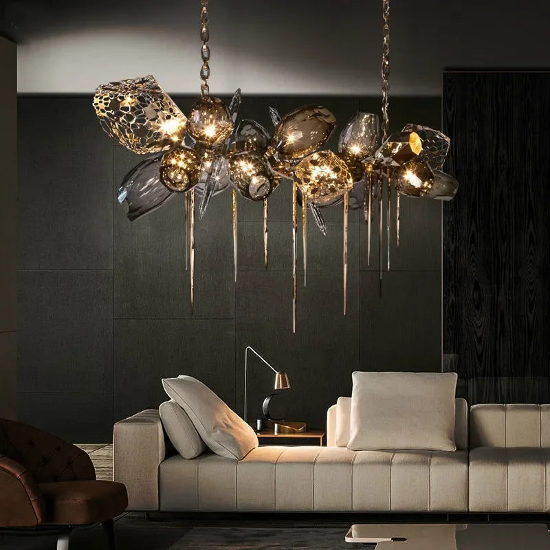 Gold frame pendant light with sculpted glass elements
